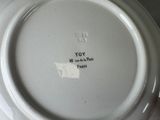 a white plate with a black and white design on it