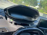 a car dashboard with a steering wheel and a dash board