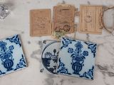 three coasters with blue and white designs on them on a table