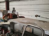 a workbench in a garage with tools on top of it