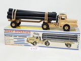 a toy truck with a large pipe attached to it ' s back