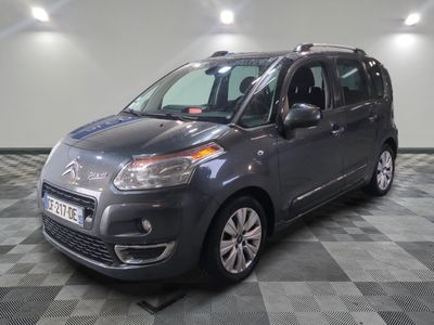 the grey citrole is parked in the garage on a checkered floor