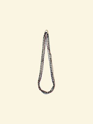 an image of a necklace with a long chain hanging from it ' s end