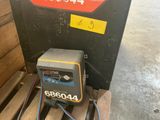 a close up of a machine on a pallet in a warehouse