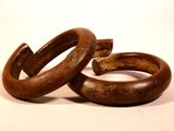 two rings that are sitting on a white surface