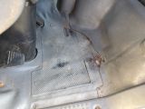 a bug that is sitting on the floor of a car