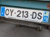 a truck that has a sign on the back of it