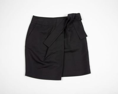 a black skirt with a bow at the waist
