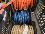 a basket full of different colored ropes in a store