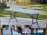 the table is in the box for sale on the sidewalk