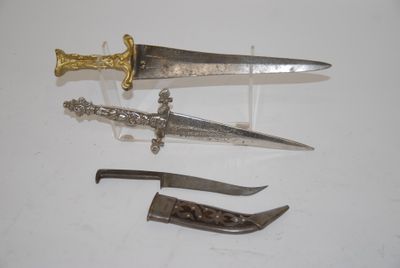several different types of knives are displayed on a white surface