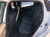 the back seat of a car with a bottle of water in the passenger seat