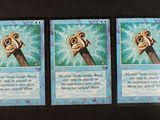three cards with a picture of a monkey on them on a table