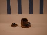 a small cup and saucer sitting on a table
