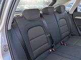 four seats in the back of a car that are empty
