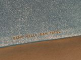 blue leather wallet with gold lettering on it sitting on a wooden surface