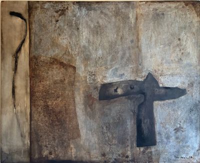 a painting of a cross on the wall of a building