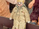 a small doll that is sitting on top of a boat
