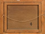 an old wooden frame with a rope hanging from it ' s side