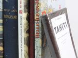 many books that are sitting on a shelf together