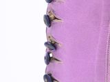 purple boots with black buttons on the side of them on a white background