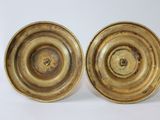 pair of antique brass candlesticks on a white background