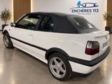 an image of a white car parked in a showroom