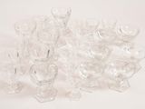 a lot of glasses that are sitting on a table