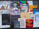 a lot of books that are on a table