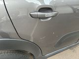 a close up of a car door handle with a sticker on it
