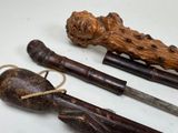 three different types of canes on a white surface