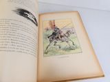 un livre ouvert avec l'image d'un homme à cheval
