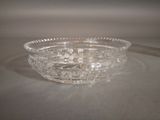 a glass bowl that is sitting on a table