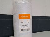 a roll of white tissue sitting on a counter