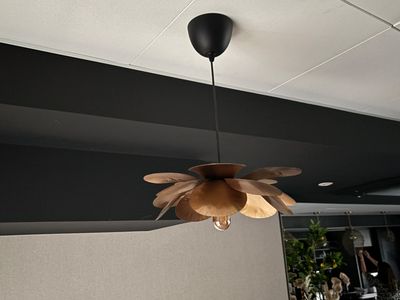 a lamp that is hanging from the ceiling in a room