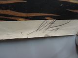 a piece of paper with writing on it next to a mouse