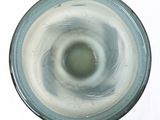 a close up of a glass with a liquid inside of it