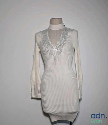 an image of a dress on a mannequin stand
