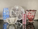 a lot of glass vases sitting on a table