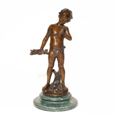 bronze statue of a boy with a dog on a marble base