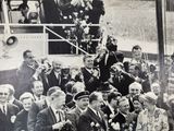 black and white photograph of a crowd of people on a boat
