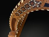 an image of a close up of a wooden object on a black background
