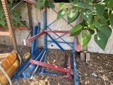 a pile of junk on the ground next to a fence