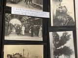 an old photo of a train station with pictures on it