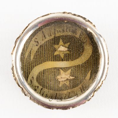 an image of a close up of a bottle cap with a picture of a star on it