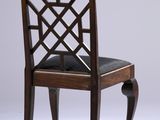 a wooden chair with a black seat on a white background