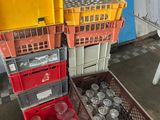 many plastic cups and crates in a room