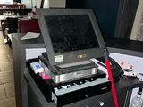 a laptop computer sitting on top of a table in a room