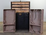 two open suitcases sitting on the floor in a room