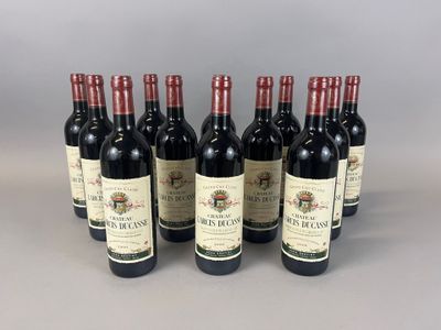 six bottles of red wine lined up in a row